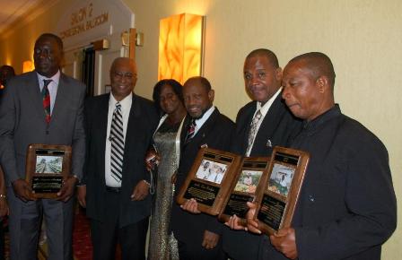 Premier of Nevis, Hon. Joseph Parry with Awardees-L to R- Mr. Augustine Merchant, Premier Parry, Mrs. Emontine Thompson, Prime Minister Dr. Denzil Douglas, Mr. Eric Evelyn and Mr. William Thompson (husband of Emontine Thompson)